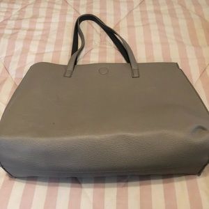 Reversible gray tote with snap closure